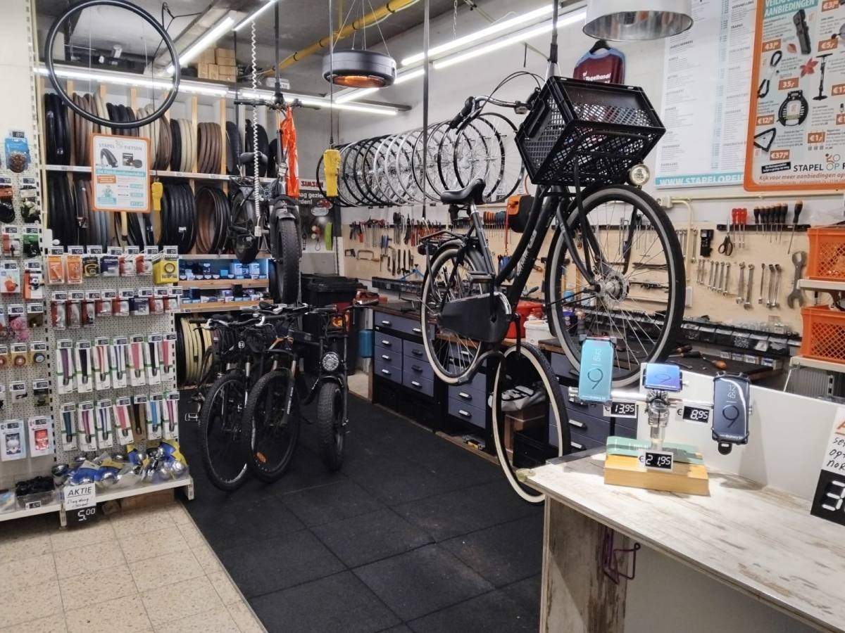 The workshop with tools, wheels and a bike in the stand
